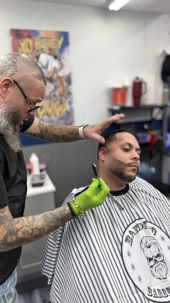 Client with fresh beard trim and clean edge at the shop.