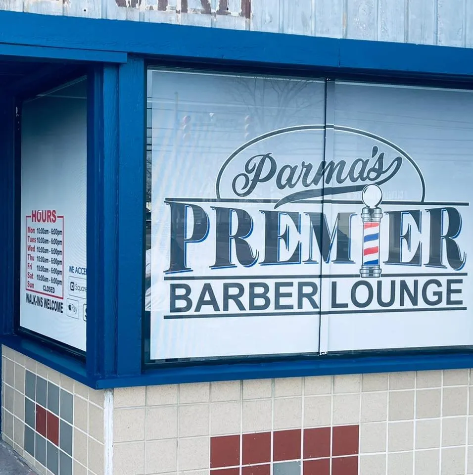 Parma Premier Barber Lounge storefront window signage.