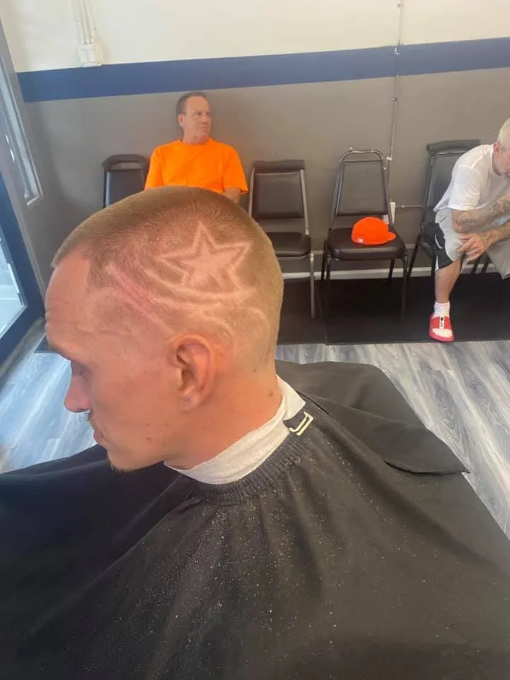 Client showcasing a fresh buzz cut and beard trim.