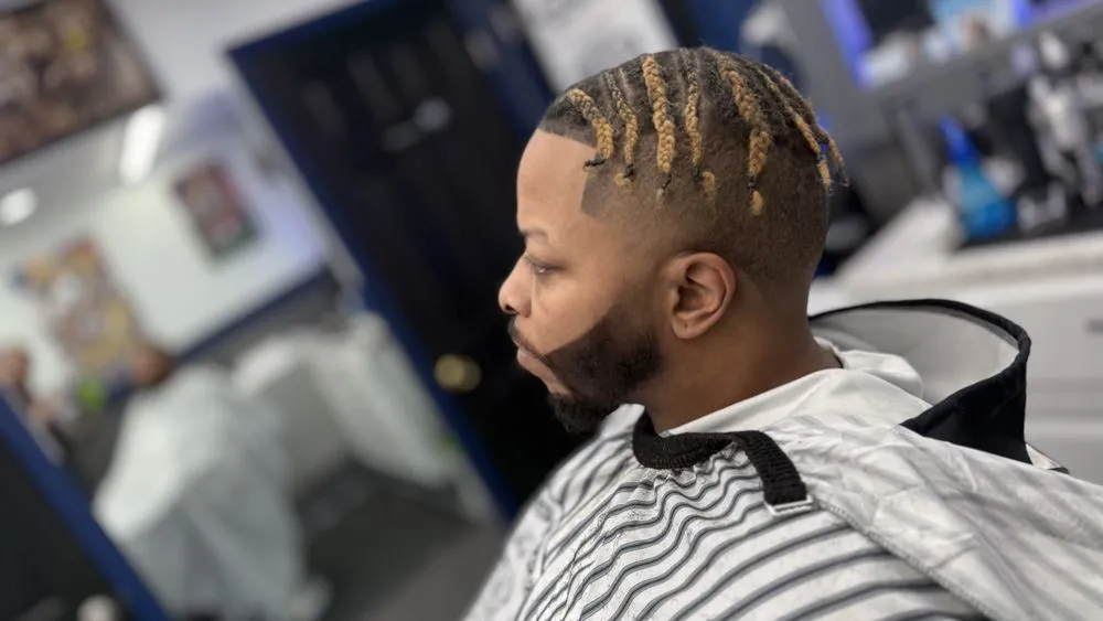 Clean buzz cut with defined beard shape.