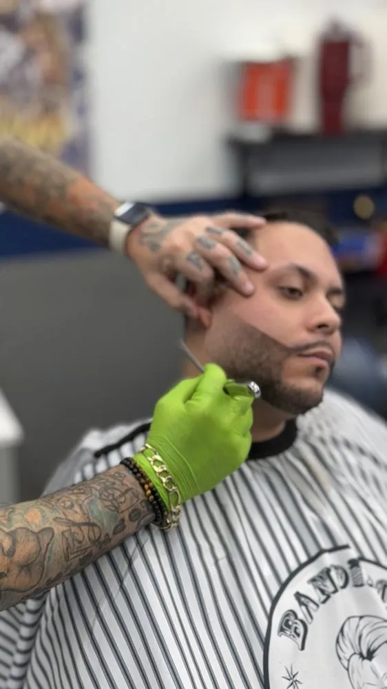 Client with mid fade and textured top styling.