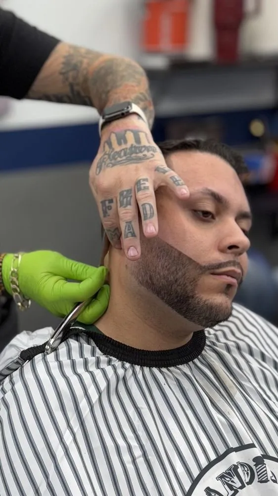 Client with curly top and skin fade result.